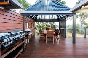  The covered alfresco area is the perfect spot to fire up the BBQ and enjoy outdoor meals while soaking in the sweeping valley views.