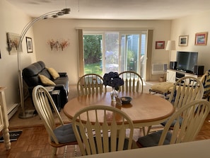 View from the kitchen to the dining, and living area, to your own private patio.