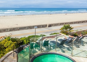 Hot tub and lounge chairs on the raised patio