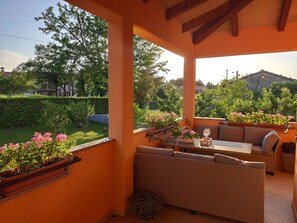 Big comfort outdoor furniture on spacious terrace providing astonishing view