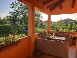 Big comfort outdoor furniture on spacious terrace providing astonishing view