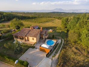 House and surrounding rural area view from above