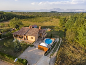 House and surrounding rural area view from above