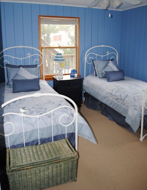 The First Bedroom has two twin beds.