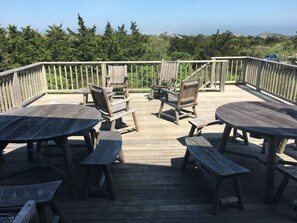 Deck off the kitchen. Plenty of seating and space for hosting.