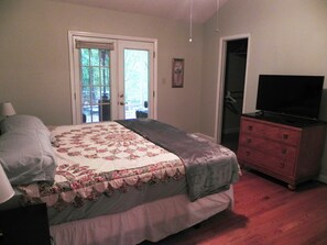 Master bedroom with king bed, bath and screened porch