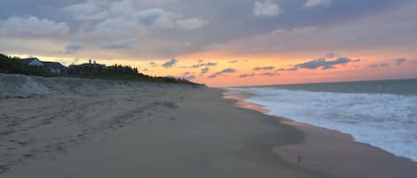 Private ocean beach access looking north at sunset