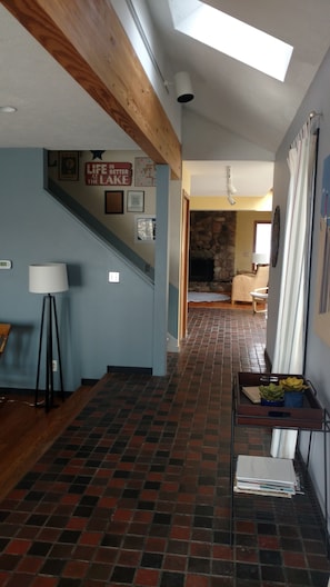 Entering the house from the front door.  Family room fireplace can be seen