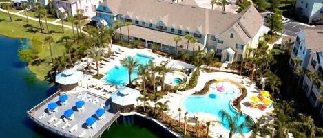 Aerial view of lagoon, seasonally heated pools and clubhouse