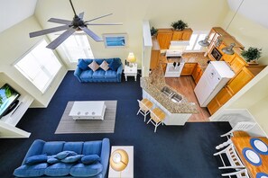 Open and airy -- Cathedral ceilings with ceiling fan . 