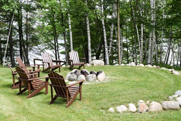 Outdoor fire pit overlooks Rabbit Lake. 