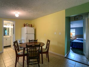 Dining table accommodates four. Open kitchenette good for conversation.