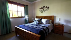 Queen Bed with Wall mounted TV