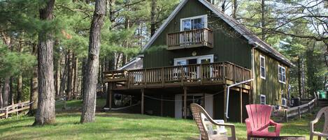 Located in the pine trees on lake delton with large main floor deck.