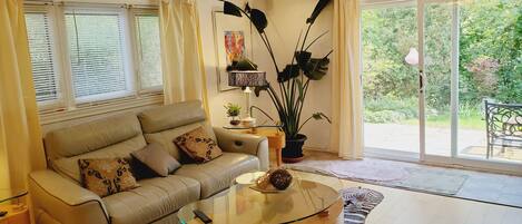 Bright living room with patio doors to garden