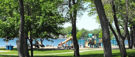 Playground and sandy beach access across the street