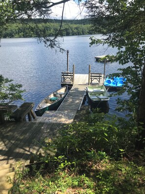 Private dock with canoe, rowboat and paddle boat, plus swimming dock!