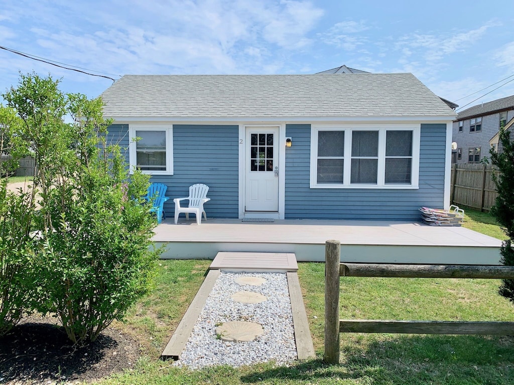 A blue Massachusetts vacation rental on a sunny day