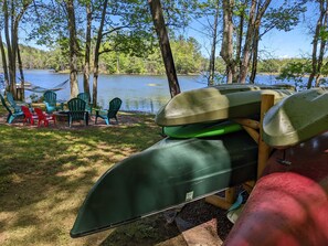 Hammock, yard, 2 canoes, rowboat, 2 kayaks, stand up paddleboard, & firepit