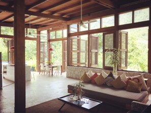 Open living & dining with walk out to the pool and 180 degree Piton & Sea views