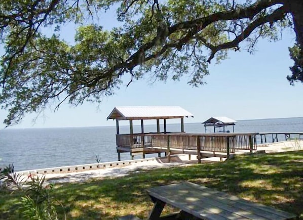 Quiet spot on Mobile Bay has covered dock