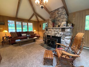 Stone fireplace w/wood stove.