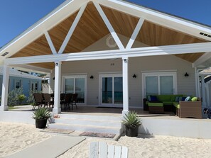 Veranda with 8 person dining table and sectional sofa to relax