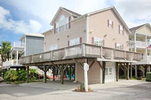 AMPLE PARKING UNDER THE HOUSE FOR UP TO THREE VEHICLES AND ONE GOLF CART