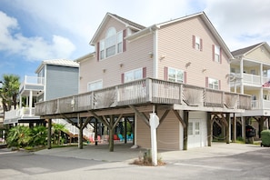 AMPLE PARKING UNDER THE HOUSE FOR UP TO THREE VEHICLES AND ONE GOLF CART