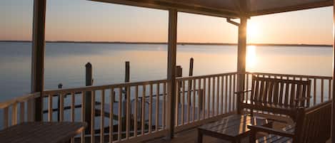 Sit back, relax, and enjoy sunsets from your own private covered porch