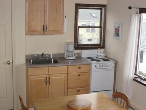 Kitchen area with new 4 burner stove and oven