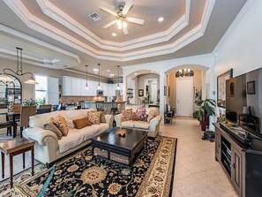 Spacious living room with large flat screen TV