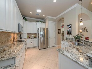 Large refrigerator and induction cook-top stove