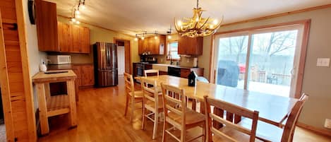 A well stocked kitchen with easy access the spacious deck.