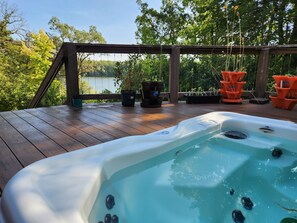 Hot tub working year round, a few steps down from the main deck.