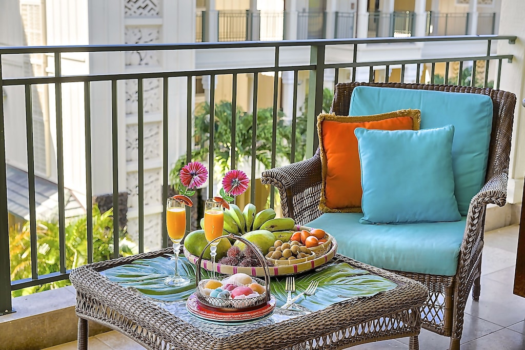Breakfast on the terrace with chair and blue pillows