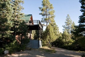 The north elevation of the house with the master suite and huge sunset view deck