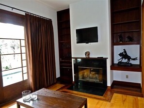 .Den with fireplace and it's own flta screen TV