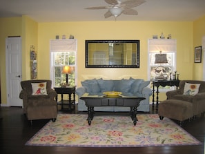 Bright and cheery main level family rm with seating for 6 plus misc stools.