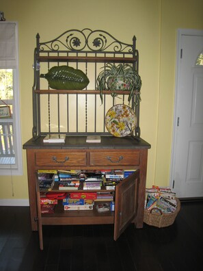 The entertainment corner with a cabinet full of games and books plus magazines!