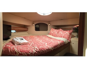 Forward Bedroom with a flatscreen and hatch to let in the fresh sea air!