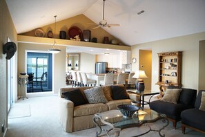 View from family room into kitchen.  Off to right is laundry room and 3rd suite.