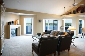 Family room has great window views, fireplace and vaulted ceilings.