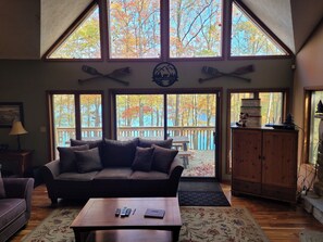 Family room view looking out onto the porch and the lake beyond