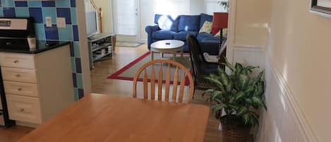 Dining area / kitchen in foreground, living room in background