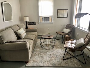 Living room with queen sized sleeper sofa.