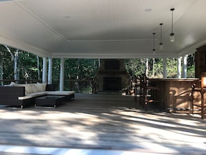 Pool Pavilion with Outdoor fireplace and bar