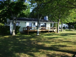 Ranch style house, with raised deck with spectacular lake view.