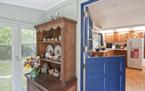 Enter the studio through the Dutch door from the screened-in blue stone porch