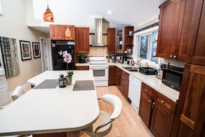 Upstairs kitchen - table shaped as grand piano